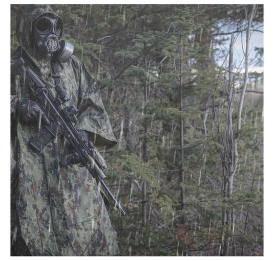 A Sniper In A Camouflage Suit Poncho And Gas Mask With A Sniper